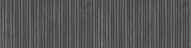Lames verticales gris ardoise réellement creusées, à l’ombre marquée entre chaque lame