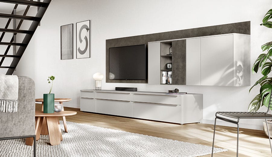Bespoke reception desk in a shop, with integrated lighting and a fitted display wall